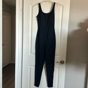 NWT black sport jumpsuit with built in bra